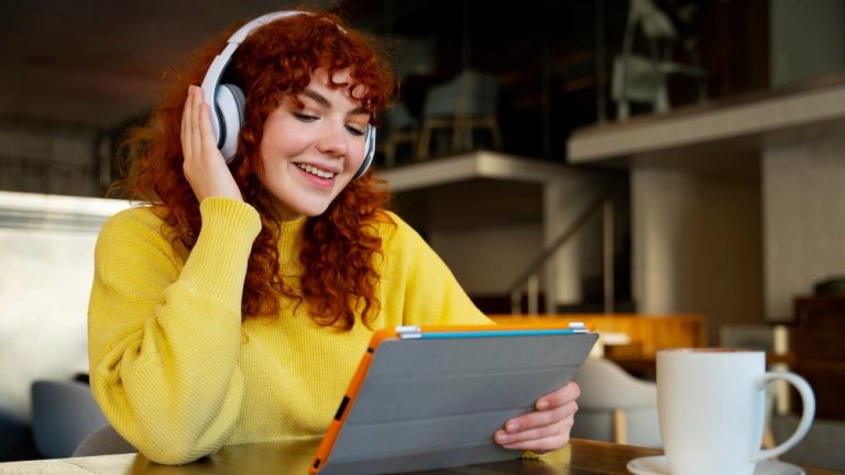 woman browsing online catalog with music