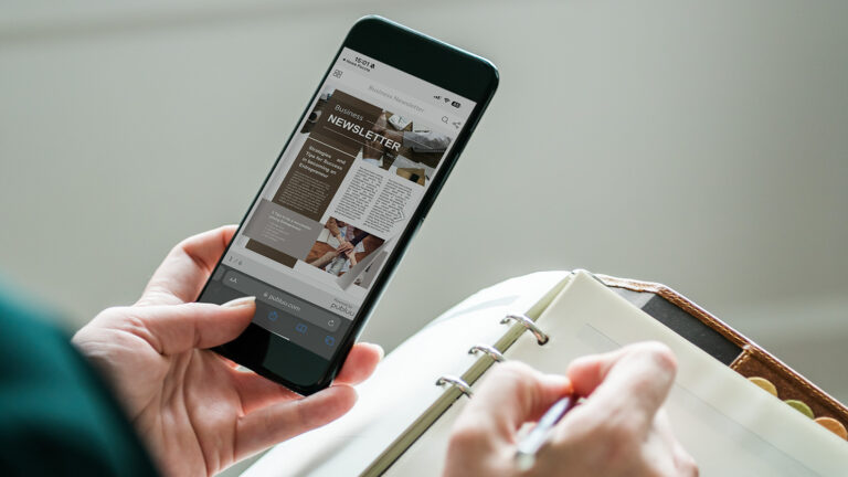 reading-sent-email-newsletter-on-mobile-device