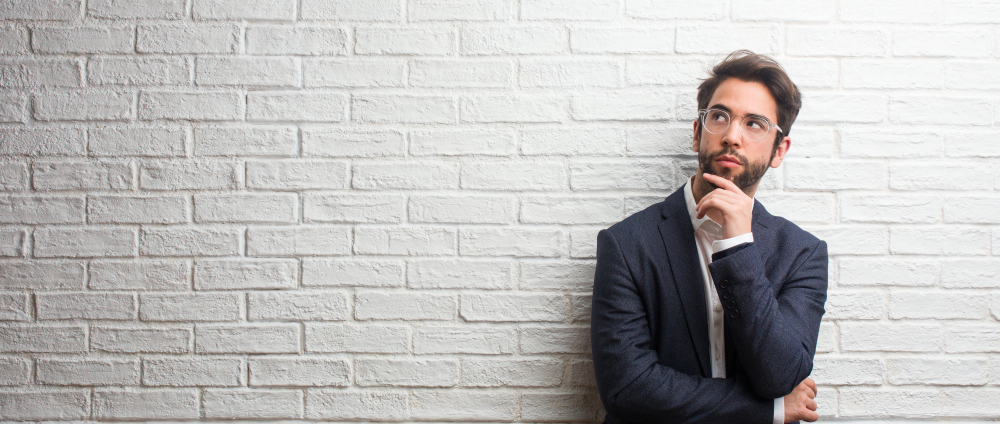 man thinking about business playbook